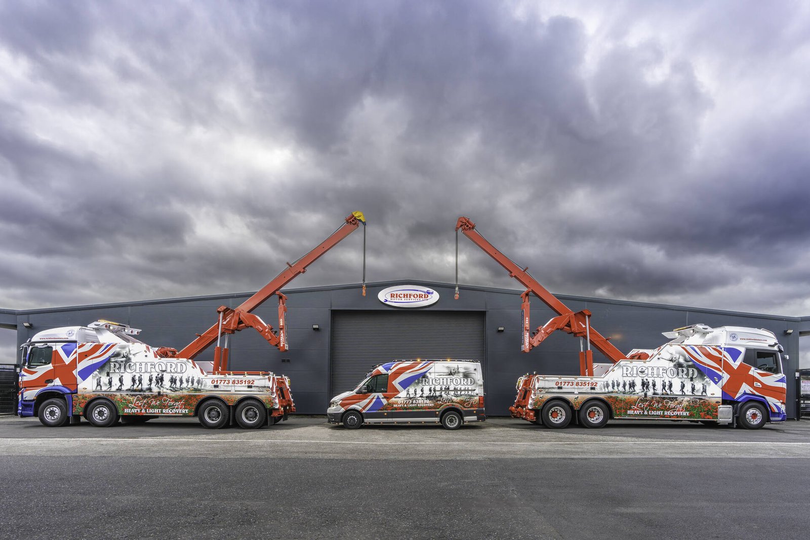 The Richfords heavy recovery fleet lined up at the depot with cranes raised